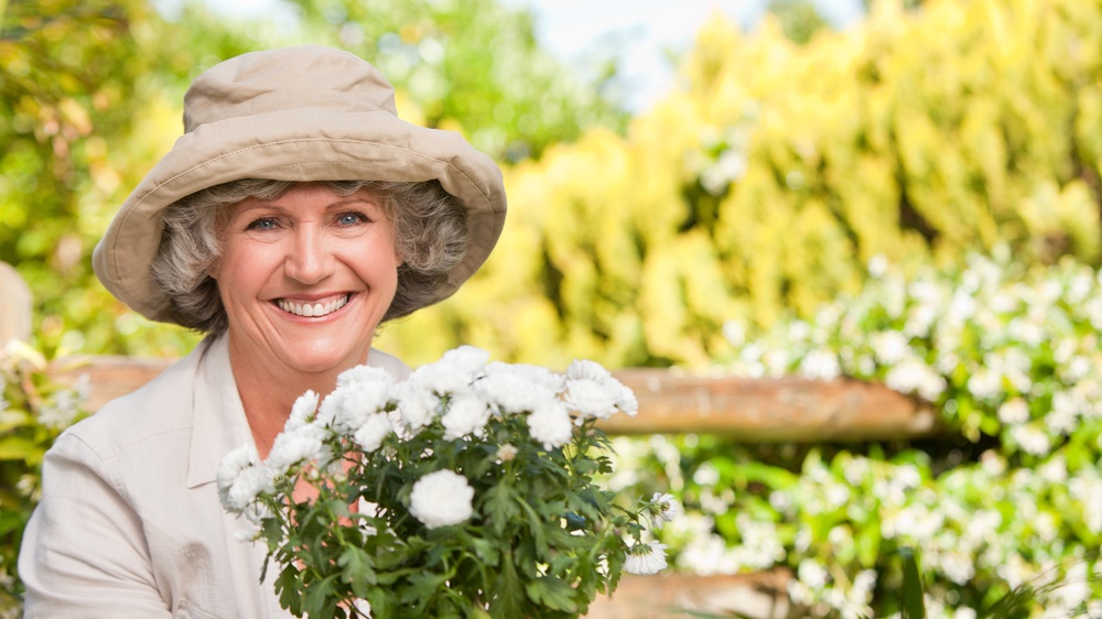 Smiling woman in her garden.jpeg